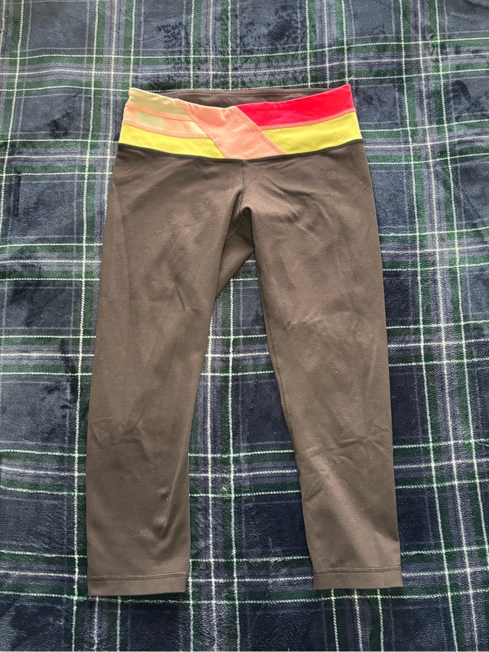 Y2K 2000s Lululemon Black Capri  leggings with pink and yellow waistband.